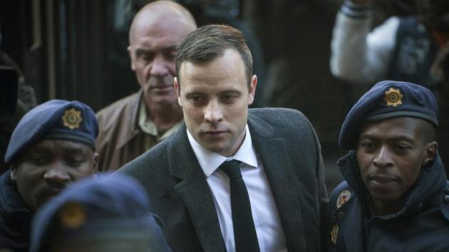 Oscar Pistorius (C )arrives at the High Court in Pretoria, South Africa, for a sentencing hearing for the murder of his girlfriend Reeva Steenkamp in his home on Valentine's Day 2013. (AP)
