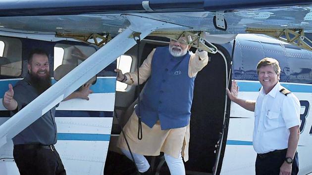 Prime Minister Narendra Modi waves to the crowd as he boards a seaplane on the Sabarmati riverfront in Ahmedabad on Tuesday. (PTI) Prime Minister Narendra Modi waves to the crowd as he boards a seaplane on the Sabarmati riverfront in Ahmedabad on Tuesday. (PTI)