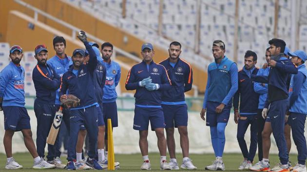Indian cricket team players listen to their fielding coach, Ramakrishnan Sridhar (fourth from left), during the practice session in Mohali on Tuesday. (AP) Indian cricket team players listen to their fielding coach, Ramakrishnan Sridhar (fourth from left), during the practice session in Mohali on Tuesday. (AP)