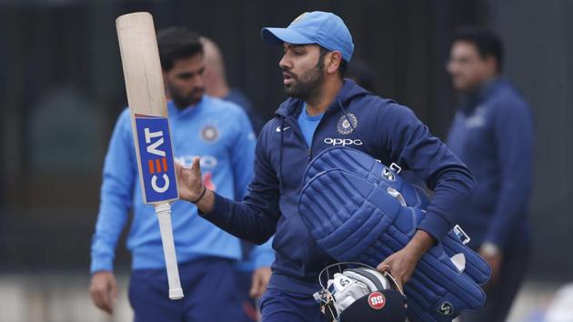 Indian cricket team stand-in skipper Rohit Sharma juggles his bat as he walks for a nets session ahead of the second ODI against Sri Lanka cricket team in Mohali. (AP) Indian cricket team stand-in skipper Rohit Sharma juggles his bat as he walks for a nets session ahead of the second ODI against Sri Lanka cricket team in Mohali. (AP)