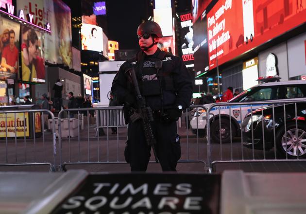 A policeman stands guard in Times Square not far from the site of a pipe bomb explosion on December 11, 2017 in New York City. (AFP Photo) A policeman stands guard in Times Square not far from the site of a pipe bomb explosion on December 11, 2017 in New York City. (AFP Photo)