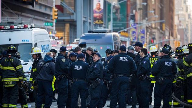 New York City police department officers and other first responders work the scene near the New York Port Authority Bus Terminal, on Monday. (AFP) New York City police department officers and other first responders work the scene near the New York Port Authority Bus Terminal, on Monday. (AFP)