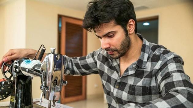 Varun Dhawan works at a sewing machine for Sui Dhaaga. Varun Dhawan works at a sewing machine for Sui Dhaaga.