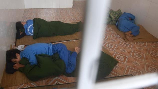 Inmates are curled up on the floor of a locked room, subjected to cold turkey withdrawal. This centre houses some 500 addicts --mostly admitted by relatives-- who after an initial period behind padlocked doors are moved to dorm rooms. Once clean, they are put to work sewing shoes or tending vegetable gardens and can receive vocational training as electricians or carpenters. (AFP) 