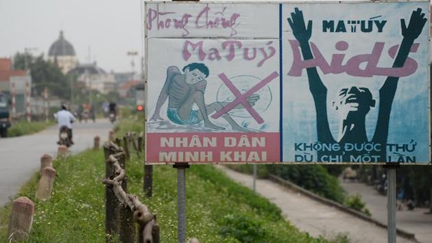 Roadside signage warns on the dangers of drug addiction at a village in the outskirts of Hanoi. Between 2014 and 2016 more than 65,000 addicts cycled through theses centres, usually a mix of compulsory patients sent by police and those admitted by exasperated relatives. Up to 80 percent of addicts from the centres relapse, according to official figures.  (AFP) 