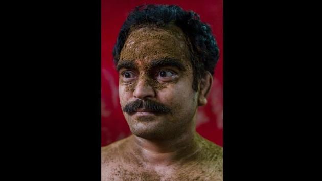 Uday Shiv, a kushti wrestler, is seen caked with earth from a kushti pit, during his daily training in New Delhi. The pehelwans live an ascetic lifestyle, eating specific foods like almond milkshakes and chapattis slathered with ghee. They don’t eat meat and refrain from smoking, drinking and dating. (Dar Yasin / AP) Uday Shiv, a kushti wrestler, is seen caked with earth from a kushti pit, during his daily training in New Delhi. The pehelwans live an ascetic lifestyle, eating specific foods like almond milkshakes and chapattis slathered with ghee. They don’t eat meat and refrain from smoking, drinking and dating. (Dar Yasin / AP)
