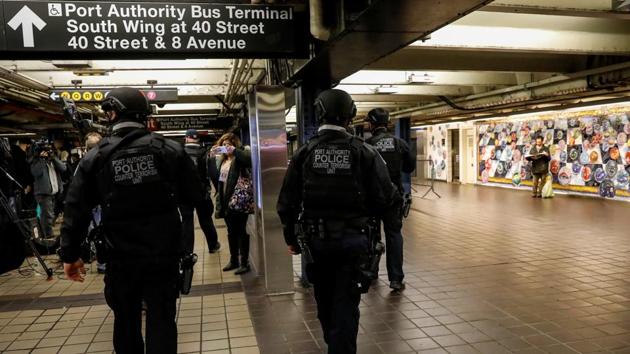 Members of the Port Authority Police Counter Terrorism unit patrol the subway corridor, at the New York Port Authority subway station near the site of an attempted detonation the day before, during the morning rush in New York City, US, on Tuesday.(REUTERS)