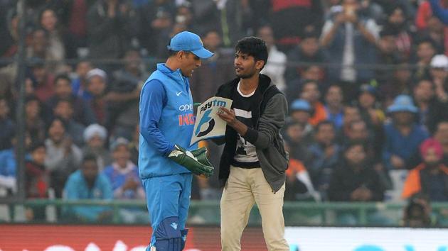 An Indian cricket fan approached MS Dhoni during the second One Day International (ODI) cricket match between India and Sri Lanka at Mohali. (AFP) An Indian cricket fan approached MS Dhoni during the second One Day International (ODI) cricket match between India and Sri Lanka at Mohali. (AFP)