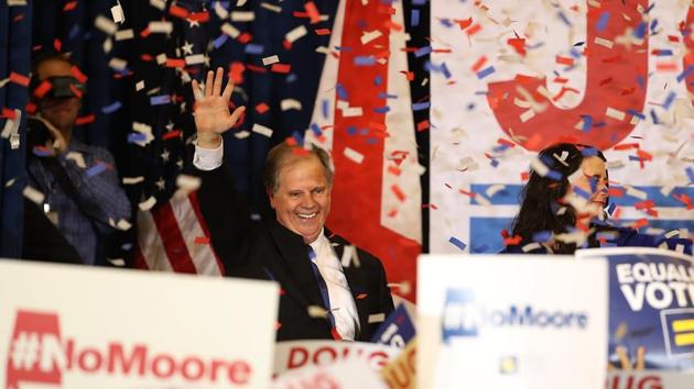 Democratic US Senator-elect Doug Jones greets supporters during his election night gathering at the Sheraton Hotel on Tuesday in Birmingham, Alabama. (AFP) Democratic US Senator-elect Doug Jones greets supporters during his election night gathering at the Sheraton Hotel on Tuesday in Birmingham, Alabama. (AFP)
