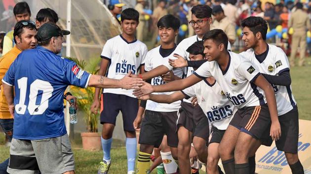 Maradona meets young footballers during a football workshop at Barasat in North 24 Parganas on Tuesday. (PTI)