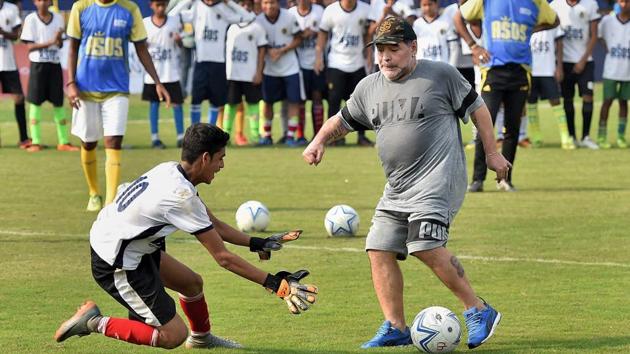 Diego Maradona shows his skills during a football workshop at Barasat, West Bengal, on Tuesday. (PTI)