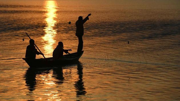 Fishermen at the Brahmaputra river during sunset in Guwahati. (AFP File) Fishermen at the Brahmaputra river during sunset in Guwahati. (AFP File)