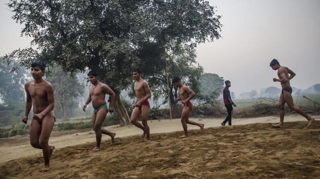 Wrestlers practice at an akhada at Bahadurgarh, Haryana. Coach Hemand Kumar, 35, recalls starting at age 10; getting up before dawn to watch his father wrestle. The boys who take it up are saved from “the nonsense” of the streets, he says. But kushti’s future is uncertain faced with a rapidly rising middle class. “The rich kids, they don’t want to do it,” he says. “Those people who don’t have the money, they’re interested. But they don’t have the resources.” (Dar Yasin / AP) Wrestlers practice at an akhada at Bahadurgarh, Haryana. Coach Hemand Kumar, 35, recalls starting at age 10; getting up before dawn to watch his father wrestle. The boys who take it up are saved from “the nonsense” of the streets, he says. But kushti’s future is uncertain faced with a rapidly rising middle class. “The rich kids, they don’t want to do it,” he says. “Those people who don’t have the money, they’re interested. But they don’t have the resources.” (Dar Yasin / AP)