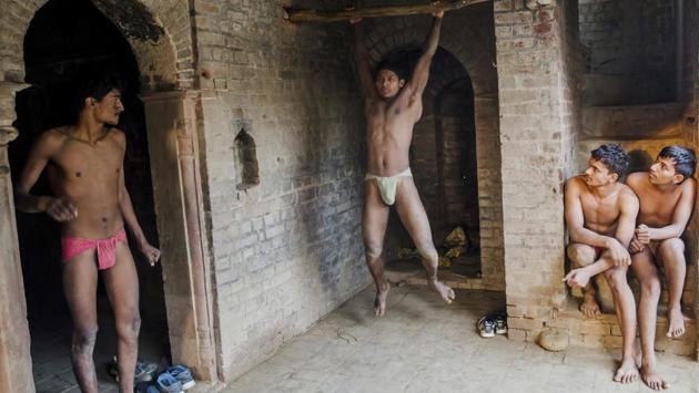 Kushti wrestlers warm up during their daily training at an akhada in Bahadurgarh, Haryana. Like many traditions in rapidly modernizing India, the ancient style of kushti wrestling faces the threat of being left behind. But for many poor families, success in this sport provides a glimmer of hope in the form of money, respect in their communities and even a secure livelihood through particular jobs. (Dar Yasin / AP)