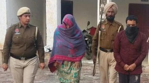 Paramjit Kaur and Harwinder Singh in police custody at Longowal on Tuesday.(HT Photo)