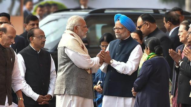 Prime Minister Narendra Modi greets former PM Manmohan Singh during a ceremony for the martyrs of the 2001 Parliament attack at Parliament House in New Delhi on Wednesday. (PTI) Prime Minister Narendra Modi greets former PM Manmohan Singh during a ceremony for the martyrs of the 2001 Parliament attack at Parliament House in New Delhi on Wednesday. (PTI)