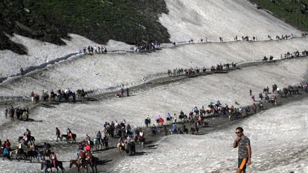 File photo of pilgrims crossing mountain trails during their journey to the Amarnath cave on the Baltal route from Srinagar earlier this year. (PTI) File photo of pilgrims crossing mountain trails during their journey to the Amarnath cave on the Baltal route from Srinagar earlier this year. (PTI)