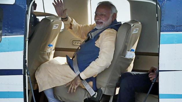 Prime Minister Narendra Modi waves to the crowd as he boards a seaplane on the Sabarmati river front in Ahmedabad. (PTI Photo) Prime Minister Narendra Modi waves to the crowd as he boards a seaplane on the Sabarmati river front in Ahmedabad. (PTI Photo)