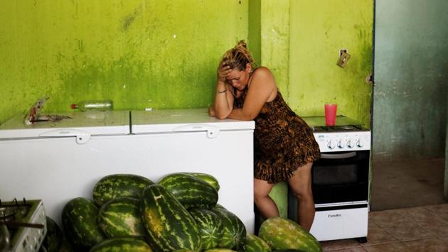 A Venezuelan woman at shelter’s kitchen in Boa Vista, Brazil. Home to the world’s largest proven oil reserves, Venezuela struggles with recession, unemployment, chronic shortages and inflation that its government said could soon top 2,000%. Meanwhile, bordering Brazil tackles an influx of migrants from Venezuela and with limited infrastructure, social services and jobs to offer them, Brazilian authorities fear a full-blown humanitarian crisis. (Nacho Doce / REUTERS) A Venezuelan woman at shelter’s kitchen in Boa Vista, Brazil. Home to the world’s largest proven oil reserves, Venezuela struggles with recession, unemployment, chronic shortages and inflation that its government said could soon top 2,000%. Meanwhile, bordering Brazil tackles an influx of migrants from Venezuela and with limited infrastructure, social services and jobs to offer them, Brazilian authorities fear a full-blown humanitarian crisis. (Nacho Doce / REUTERS)