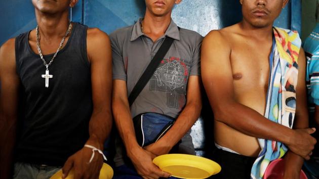 Venezuelans line up to receive food at a shelter run by Civil Defense with meals provided by Evangelical churches in Boa Vista. Okoth-Obbo noted the crush of migrants also hitting Trinidad and Tobago, the Caribbean country to Venezuela’s north, and Colombia, the Andean neighbor to the west, where hundreds of thousands have fled. (Nacho Doce / REUTERS) Venezuelans line up to receive food at a shelter run by Civil Defense with meals provided by Evangelical churches in Boa Vista. Okoth-Obbo noted the crush of migrants also hitting Trinidad and Tobago, the Caribbean country to Venezuela’s north, and Colombia, the Andean neighbor to the west, where hundreds of thousands have fled. (Nacho Doce / REUTERS)