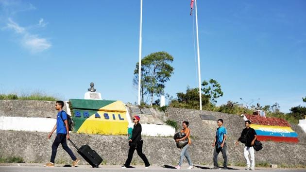 Venezuelans walk across the border from Venezuela into the Brazilian city of Pacaraima. Not even Venezuela’s government knows for certain how many of its 30 million people have fled in recent years. Some sociologists have estimated the number as high as 2 million, although President Nicolas Maduro’s government disputes this figure. (Nacho Doce / REUTERS) Venezuelans walk across the border from Venezuela into the Brazilian city of Pacaraima. Not even Venezuela’s government knows for certain how many of its 30 million people have fled in recent years. Some sociologists have estimated the number as high as 2 million, although President Nicolas Maduro’s government disputes this figure. (Nacho Doce / REUTERS)