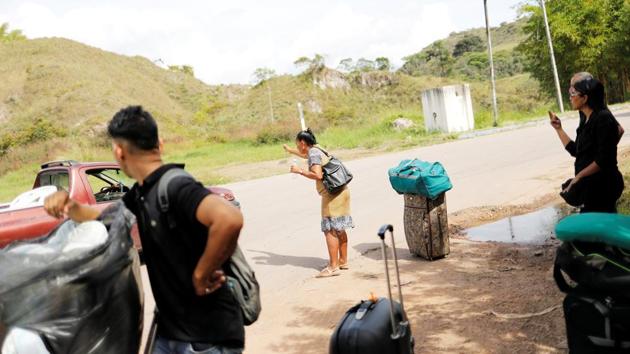 Venezuelan migrants attempt to hitchhike after crossing the Brazilian border into Pacaraima. Unlike earlier migrations, when Venezuelan professionals left for markets where their services found demand, many leaving now have few skills or resources. International authorities liken this exodus to other mass departures in Latin America, like that of Haitians after the 2010 earthquake or the 1980 flight of 125,000 Cubans by boat to the US. (Nacho Doce / REUTERS) Venezuelan migrants attempt to hitchhike after crossing the Brazilian border into Pacaraima. Unlike earlier migrations, when Venezuelan professionals left for markets where their services found demand, many leaving now have few skills or resources. International authorities liken this exodus to other mass departures in Latin America, like that of Haitians after the 2010 earthquake or the 1980 flight of 125,000 Cubans by boat to the US. (Nacho Doce / REUTERS)