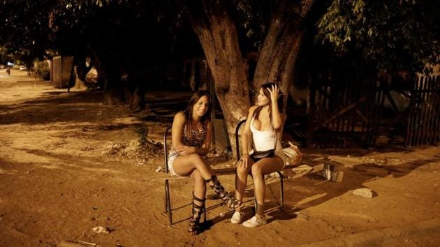 Others fare worse, struggling to find work as Brazil itself recovers from a two-year recession, its worst in over a century. Camila, a 23-year-old transsexual (R), left Venezuela nine months ago. Sex-work brings her about $100 a night --enough to send food, medicine and even car parts to her family. “Things are so bad in Venezuela I could barely feed myself.” (Nacho Doce / REUTERS) Others fare worse, struggling to find work as Brazil itself recovers from a two-year recession, its worst in over a century. Camila, a 23-year-old transsexual (R), left Venezuela nine months ago. Sex-work brings her about $100 a night --enough to send food, medicine and even car parts to her family. “Things are so bad in Venezuela I could barely feed myself.” (Nacho Doce / REUTERS)