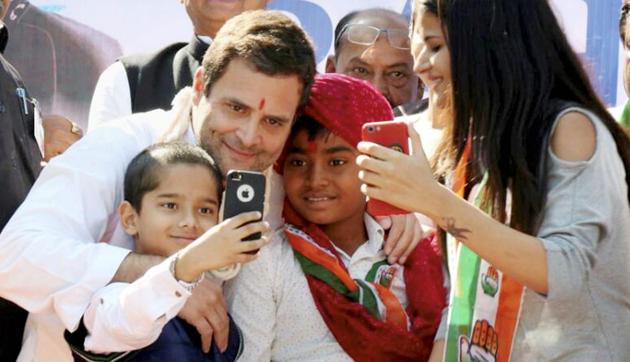 Congress president-elect Rahul Gandhi poses for a selfie with children during his public meeting at Dehgam in Gujarat’s Gandhinagar district last month.(PTI) Congress president-elect Rahul Gandhi poses for a selfie with children during his public meeting at Dehgam in Gujarat’s Gandhinagar district last month.(PTI)