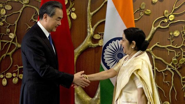 Foreign minister Sushma Swaraj shakes hands with her Chinese counterpart Wang Yi before their delegation level meeting in New Delhi, Monday. (AP Photo) Foreign minister Sushma Swaraj shakes hands with her Chinese counterpart Wang Yi before their delegation level meeting in New Delhi, Monday. (AP Photo)