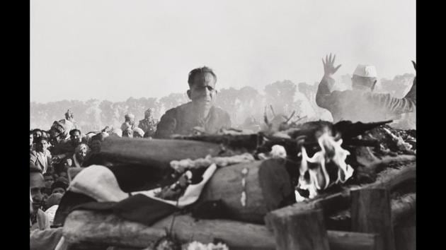 Gandhi’s secretary watches the first flames of the funeral pyre, Delhi, India, 1948. Only 90 minutes after Henri Cartier-Bresson and Mahatma Gandhi’s meeting on January 30, Gandhi was assassinated, and Cartier-Bresson became a witness to history. (Henri Cartier-Bresson / Magnum Photos) Gandhi’s secretary watches the first flames of the funeral pyre, Delhi, India, 1948. Only 90 minutes after Henri Cartier-Bresson and Mahatma Gandhi’s meeting on January 30, Gandhi was assassinated, and Cartier-Bresson became a witness to history. (Henri Cartier-Bresson / Magnum Photos)
