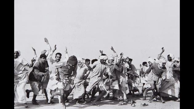 Games in a refugee camp at Kurukshetra, Punjab, India, 1947. “There is idleness and despair where people are gathered without homes. At the Kurukshetra camp, they were given simple gymnastics to distract them, to work off their energies,” wrote Cartier-Bresson. (Henri Cartier-Bresson / Magnum Photos) Games in a refugee camp at Kurukshetra, Punjab, India, 1947. “There is idleness and despair where people are gathered without homes. At the Kurukshetra camp, they were given simple gymnastics to distract them, to work off their energies,” wrote Cartier-Bresson. (Henri Cartier-Bresson / Magnum Photos)