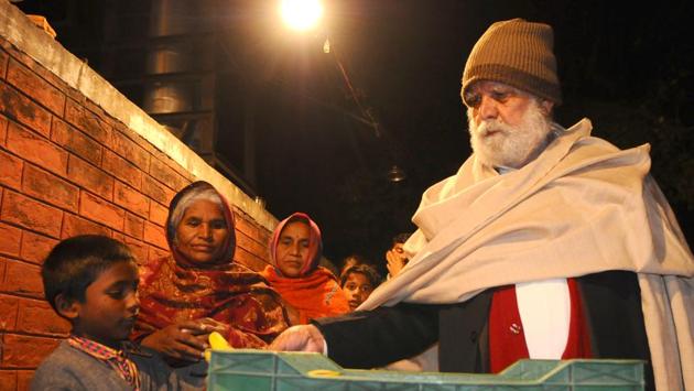 Jagdish Lal Ahuja, popularly known as PGI’s ‘langar baba’, is searching among hundreds of poor kids whom he feeds daily.(Anil Dayal/HT)