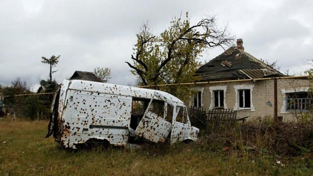A vehicle damaged by shrapnel and an explosive wave sits abandoned in Donetsk’s Oktyabrsky district. A sense of constant bleak is felt by families that lost loved ones in the war, which has claimed a total of more than 10,000 lives so far. (Alexander Ermochenko / REUTERS) A vehicle damaged by shrapnel and an explosive wave sits abandoned in Donetsk’s Oktyabrsky district. A sense of constant bleak is felt by families that lost loved ones in the war, which has claimed a total of more than 10,000 lives so far. (Alexander Ermochenko / REUTERS)