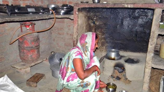 Guddi Devi of Jigni Khas village in Ballia district of Uttar Pradesh now uses the gas stove sparingly to save fuel, for quick snacks or tea for guests but not for daily cooking. (Arvind Gupta/HT Photo)