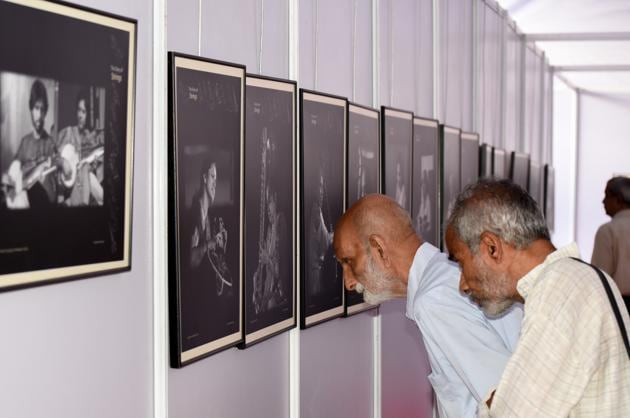 People observe the pictures exhibited at the Sawai Gandharva Bhimsen Mahotsav on Wednesday. (Sanket Wankhade/HT PHOTO) People observe the pictures exhibited at the Sawai Gandharva Bhimsen Mahotsav on Wednesday. (Sanket Wankhade/HT PHOTO)