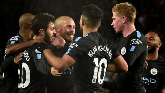 Manchester City's David Silva celebrates scoring their first goal vs Swansea City at the Liberty City Stadium in Swansea with teammates. (REUTERS) Manchester City's David Silva celebrates scoring their first goal vs Swansea City at the Liberty City Stadium in Swansea with teammates. (REUTERS)
