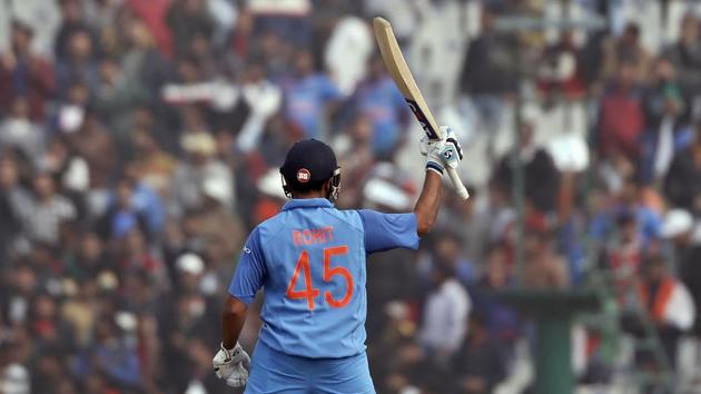 Indian cricket team stand-in captain Rohit Sharma acknowledges the applause from the crowd after scoring a double century in the second ODI against Sri Lanka cricket team in Mohali on Wednesday.(AP)