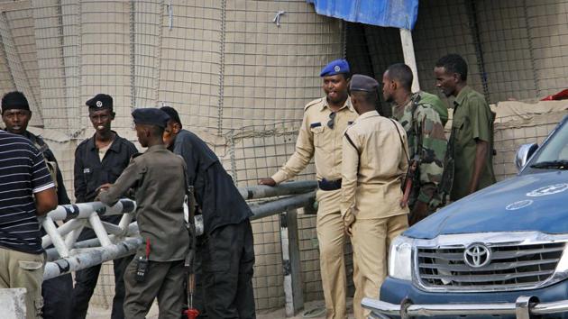 Somali police guard the road leading to the scene of a suicide bomb attack on a police academy in the capital Mogadishu, Somalia Thursday, Dec. 14, 2017. (AP Photo) Somali police guard the road leading to the scene of a suicide bomb attack on a police academy in the capital Mogadishu, Somalia Thursday, Dec. 14, 2017. (AP Photo)