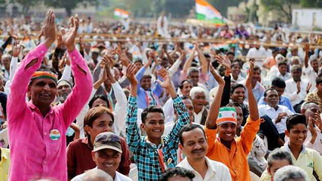 Congress supporters during an election campaign meeting Gujarat’s in Dakor. Analysts have predicted that the opposition party could give the BJP, which has been in power in the state for 22 years, a tough fight this time around. (Reuters) Congress supporters during an election campaign meeting Gujarat’s in Dakor. Analysts have predicted that the opposition party could give the BJP, which has been in power in the state for 22 years, a tough fight this time around. (Reuters)
