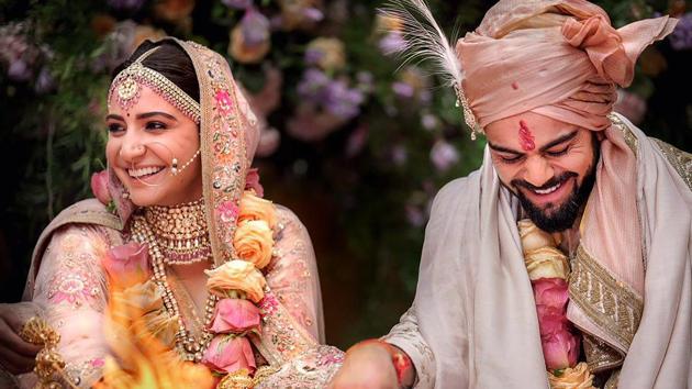 Indian cricket captain Virat Kohli with his actress wife Anushka Sharma during their wedding.(PTI)