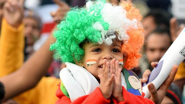 A child cheers for the Indian cricket team during the second ODI match. (AFP)