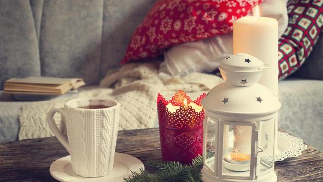 Fuzz pillows and pillar candles add a cosy feel. (Shutterstock) Fuzz pillows and pillar candles add a cosy feel. (Shutterstock)