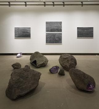 Artist Amshu Chukki’s work includes fascinating landscape of rocks, much like the kind you’ll find along the Deccan Plateau, and on the walls are his gorgeous charcoal drawings of stills from the videos. (Chatterjee & Lal) Artist Amshu Chukki’s work includes fascinating landscape of rocks, much like the kind you’ll find along the Deccan Plateau, and on the walls are his gorgeous charcoal drawings of stills from the videos. (Chatterjee & Lal)