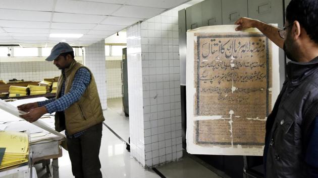 A 100-member team of archivists, scholars and employees, led by Sanjay Garg, the chief archivist, are busy with the mammoth digitisation task using computers and high-end German-made scanners. “We have got eight scanners for now. We digitise about 50,000 pages each day,” he said. (Vipin Kumar / HT Photo) 