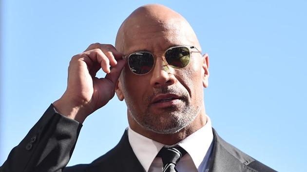 Actor Dwayne Johnson attends a ceremony honouring him with the 2,624th star on the Hollywood Walk of Fame on December 13.(AFP)