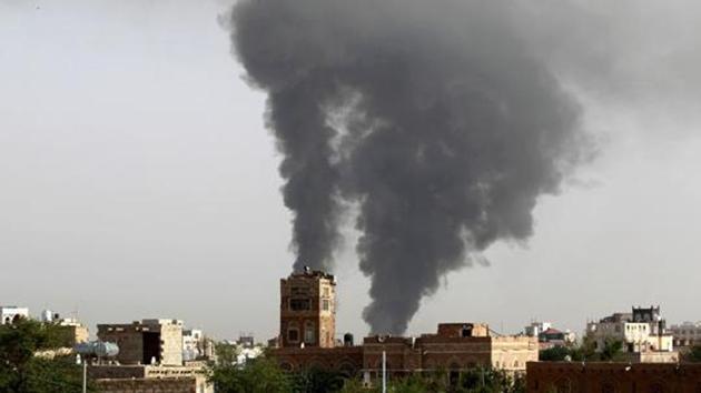 (FILES) This file photo taken on July 07, 2015 shows smoke billowing following air-strikes by the Saudi-led coalition on a weapons depot at a military airport in the capital Sanaa. (AFP) (FILES) This file photo taken on July 07, 2015 shows smoke billowing following air-strikes by the Saudi-led coalition on a weapons depot at a military airport in the capital Sanaa. (AFP)