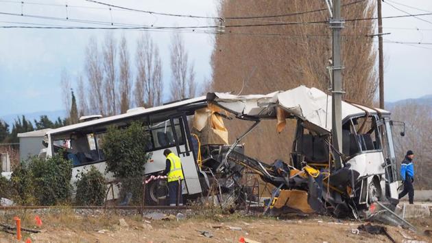 A towing service worker and a gendarme walk next to the wreckage of school bus in Millas, near Perpignan, southern France, on December 15, 2017, a day after an accident when a train crashed into the school bus at a level crossing. (AFP Photo) A towing service worker and a gendarme walk next to the wreckage of school bus in Millas, near Perpignan, southern France, on December 15, 2017, a day after an accident when a train crashed into the school bus at a level crossing. (AFP Photo)