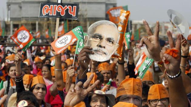 BJP supporters during a rally in Gandhinagar during the Gujarat elections.(PTI)