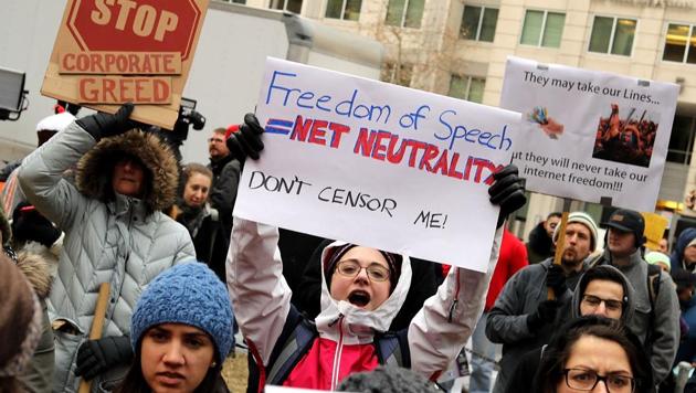 Demonstrators rally outside the Federal Communication Commission building to protest against the end of net neutrality rules in Washington DC. (AFP) Demonstrators rally outside the Federal Communication Commission building to protest against the end of net neutrality rules in Washington DC. (AFP)