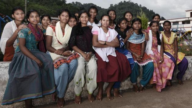 Dongria Kondh students pose for a group photo at the educational complex in Kansur village. Their numbers may not be large, but their presence as role models has egged families to overcome age-old beliefs in this remote tribal community of Odisha. (Vipin Kumar / HT Photo) 